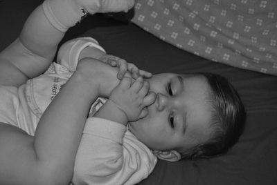 Close-up of baby sleeping on bed