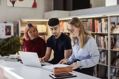 Group of students studying in library