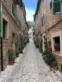 Narrow alley amidst buildings in city