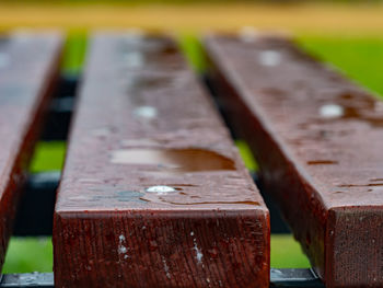 Water drops on a dark wooden background closeup. oiled wooden planks surface resistent to water drop