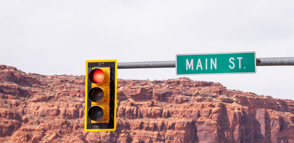 Information sign on road against clear sky