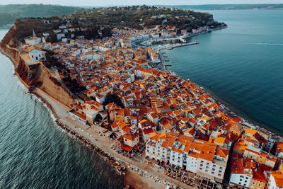 High angle view of cityscape by sea