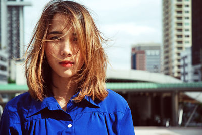 Portrait of beautiful woman with tousled hair