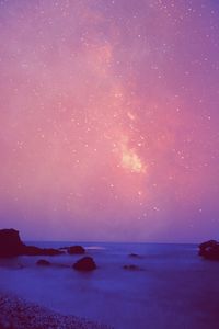 Scenic view of sea against sky at night