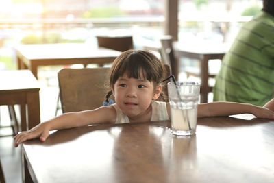 Portrait of boy on table