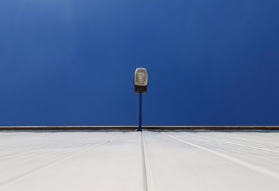 High section of built structure against clear blue sky