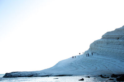 Scenic view of mountain against clear sky during winter