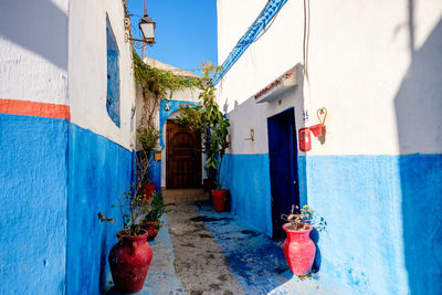 Red built structure against blue wall