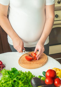 Midsection of man preparing food