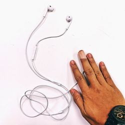 Close-up of human hand against white background