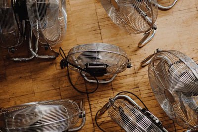 High angle view of electric fans on hardwood floor