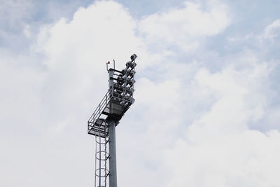 Low angle view of communications tower against sky