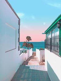 View of swimming pool by building against sky