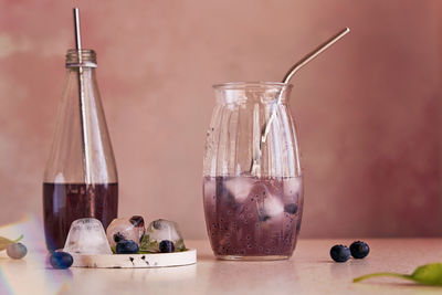 Organic natural non-alcoholic chia drink with blueberries, seeds, basil extract, leaves, ice. 