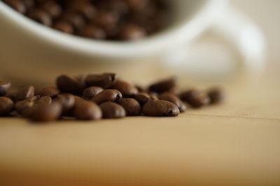 Close-up of coffee beans on table