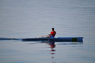 Man kayaking in sea