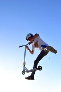 Low angle view of woman jumping