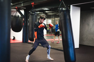 Man practicing in boxing ring