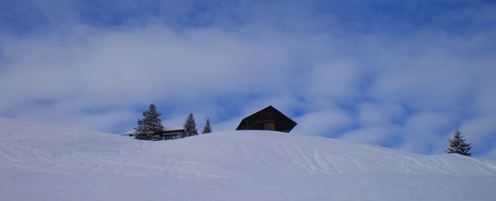 Snow covered mountain against sky