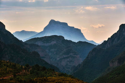 Scenic view of mountains against sky during sunset