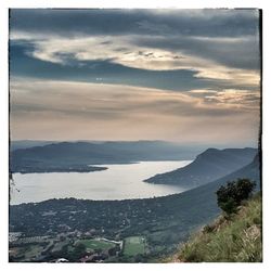 Scenic view of sea against cloudy sky