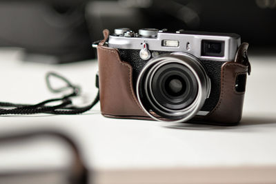 Close-up of camera on table