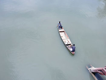 High angle view of people on boat in river