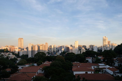 Buildings in city against sky