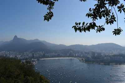 View of buildings in city against clear sky