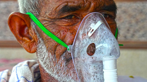 Close-up of man wearing eyeglasses