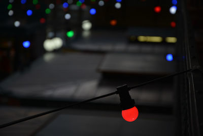 Defocused image of illuminated street lights at night