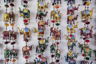 Full frame shot of multi colored decorations hanging for sale at market stall