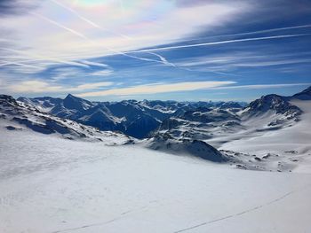 Scenic view of snowcapped mountains against sky