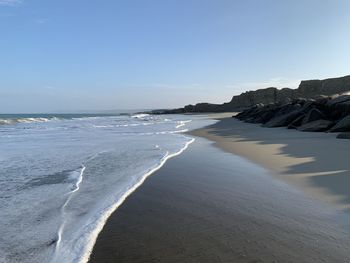 Scenic view of beach against sky