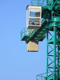 Low angle view of building against clear blue sky