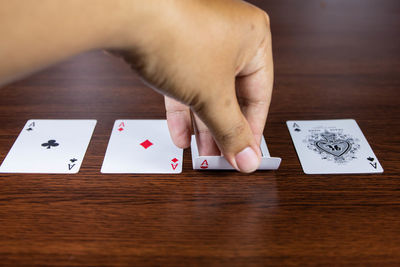 High angle view of woman hand on table