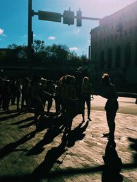 Men in city against sky