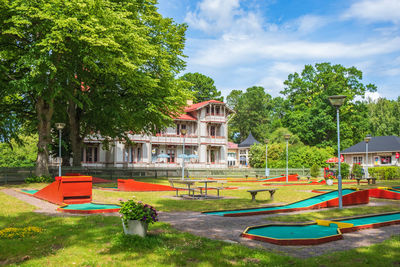 Miniature golf in a park with a old wooden house in the city hjo, sweden