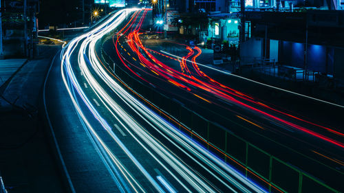 High angle view of light trails on highway at night