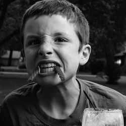 Close-up of boy eating food