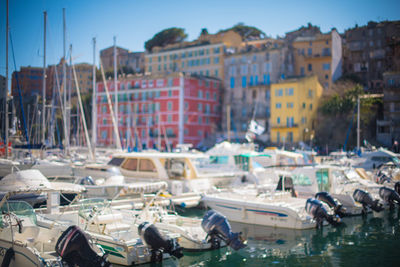 Boats moored at harbor