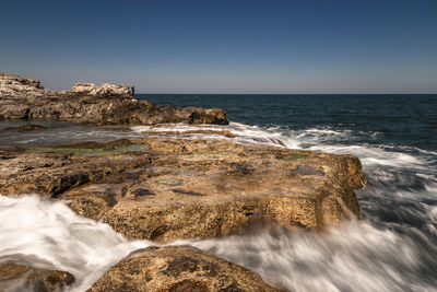 Scenic view of sea against clear sky