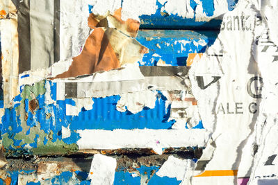 Full frame shot of torn papers on wall