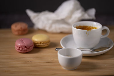 A n espresso coffee with french sweets from bakery