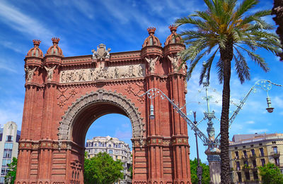 Low angle view of historical building against blue sky