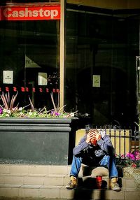 Man sitting in store