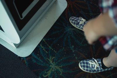 Low section of man wearing camera