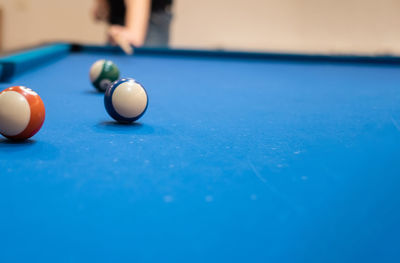 Cropped hand playing pool