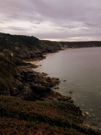 Scenic view of sea and landscape against sky