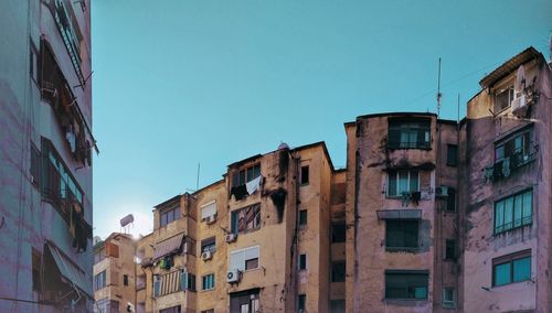 Low angle view of residential buildings against blue sky